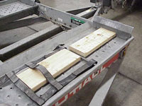 Boards on trailer deck for low ground clearance