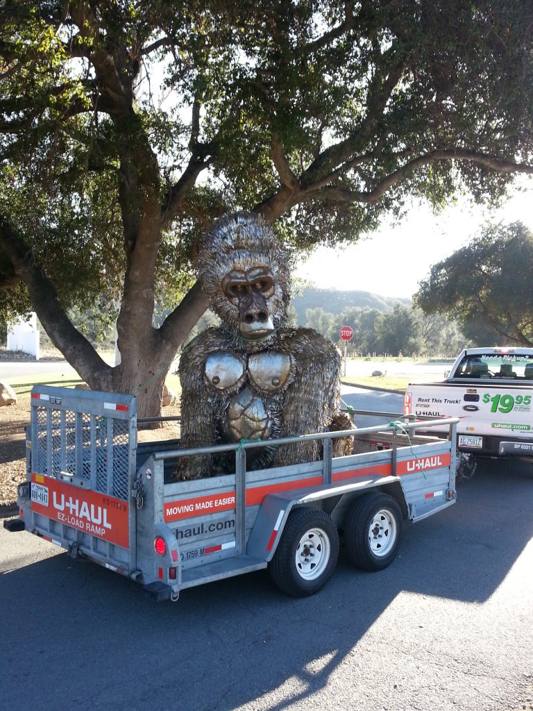 Customer uses U-Haul utility trailer to move giant gorilla statue