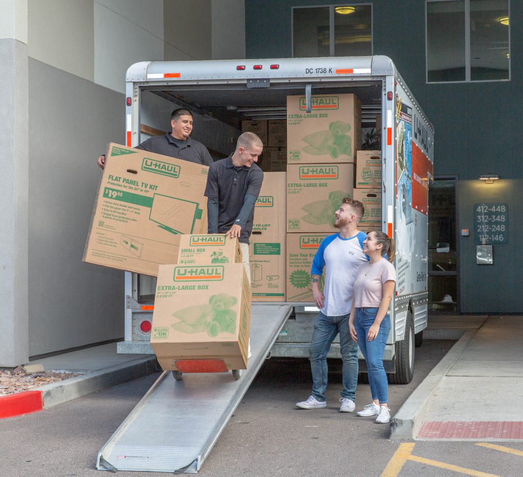 Moving helpers assisting with a move