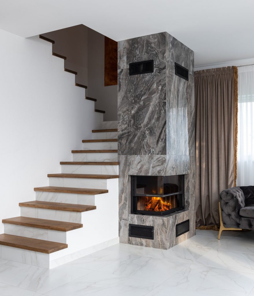 A fireplace is a great renovation idea to increase the value in your home, add to the aesthetic, and add comfort.