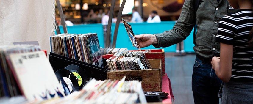 Visitors browsing a yard sale
