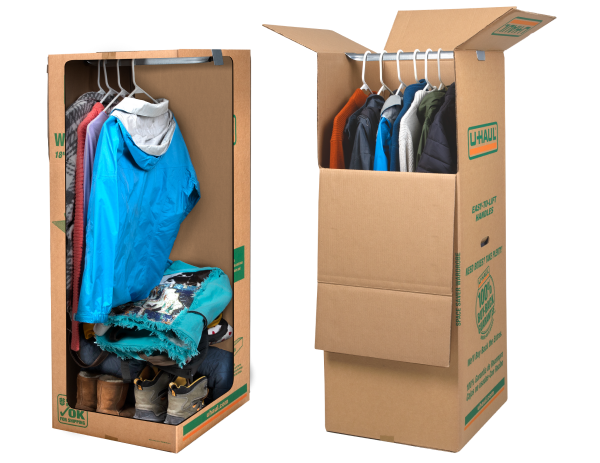 A space saver wardrobe box that is cut out to show winter clothes being stored inside.