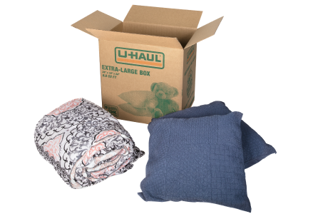 Extra-large moving box being packed.