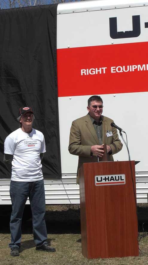 James Bezan, member of Parliament, and Real Faucher, MCP Co. 827, address onlookers.