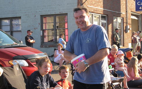Area Field Manager (AFM), Trevor Williams, UHC of Atlantic Canada, passes out candy to the crowd during the parade. 