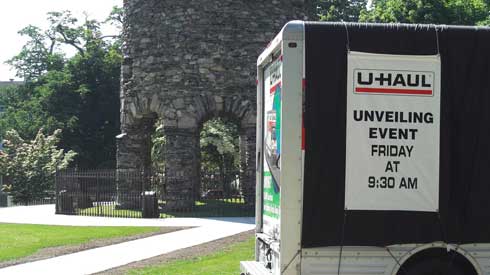 The U-Haul truck in front of the Newport Tower