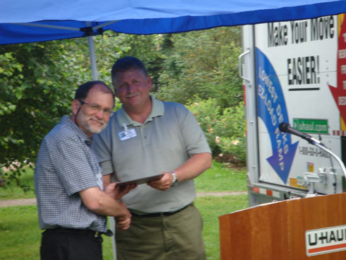 Bruce Bennett presents a plaque to Peter Hicklin, of Environment Canada's Canadian Wildlife Service.