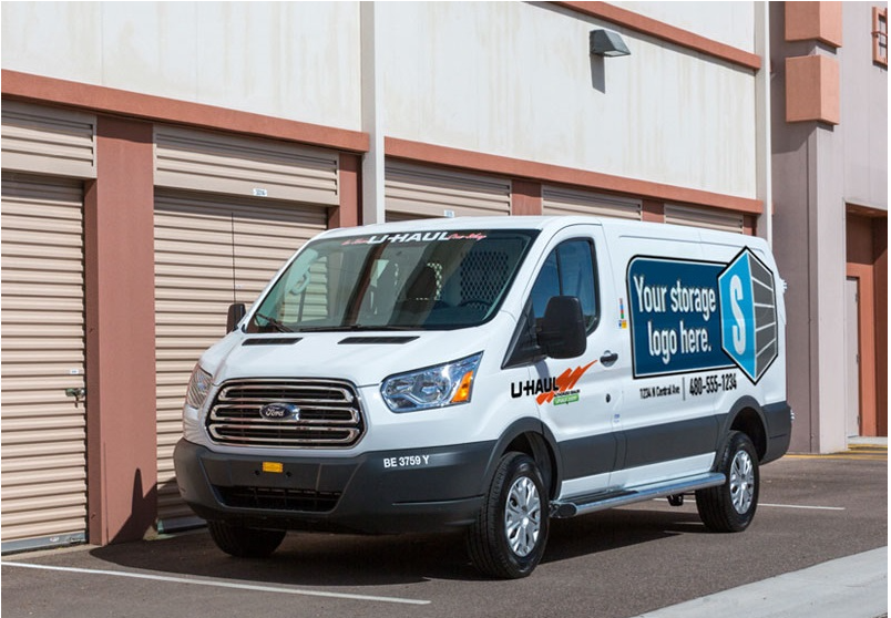 U-Haul moving van in front of a storage unit parked highlighting the space for a Storage Affiliate to advertise.
